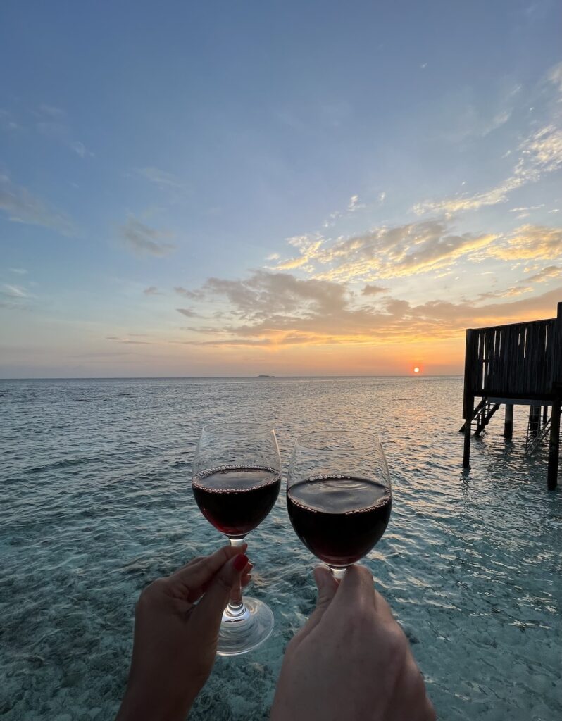Wine at the villa by sunset, costly mistakes in the Maldives