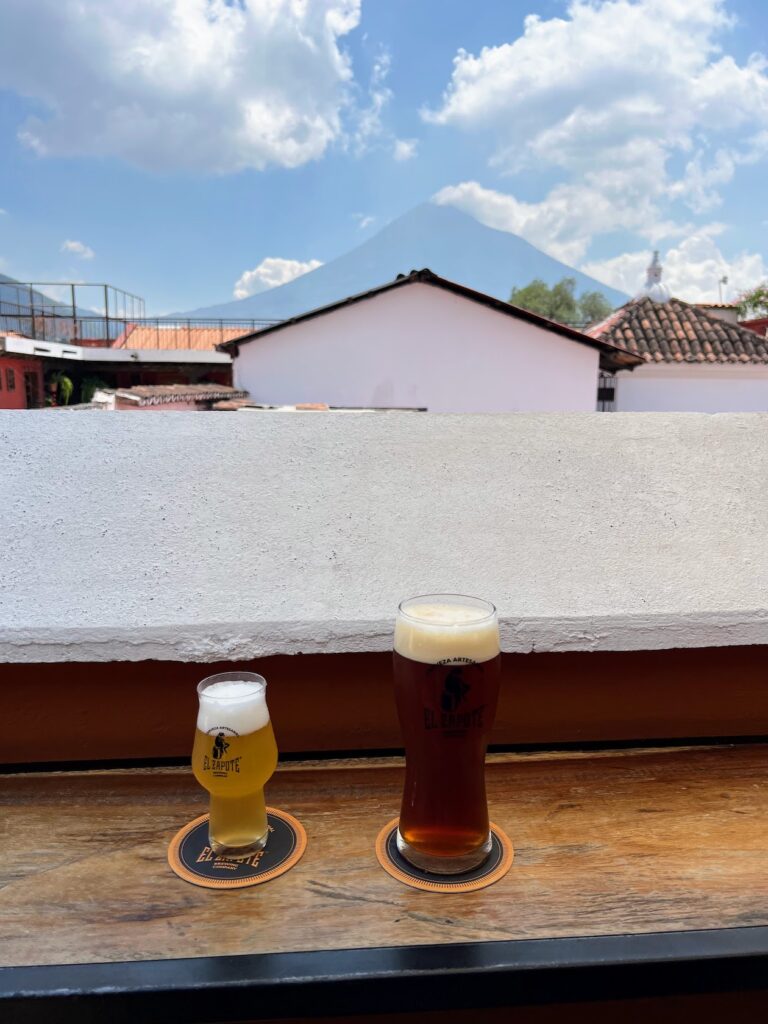 Beer with view of Antigua volcanoes (tipping in Guatemala); Guatemala itinerary 10 days