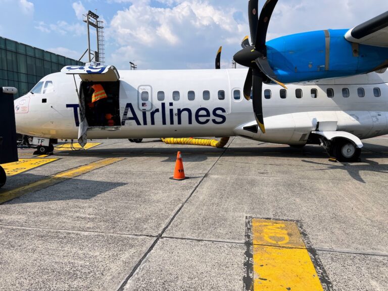 A Tag Airlines flight being loaded with luggage